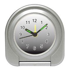 A Black And White Photo Of A Wall Travel Alarm Clock