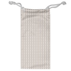 A White Background With A Brown Pattern On It Jewelry Bag