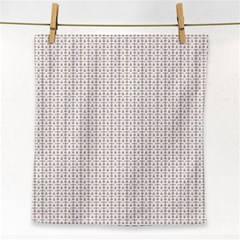 A White Background With A Brown Pattern On It Face Towel