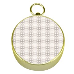 A White Background With A Brown Pattern On It Gold Compasses