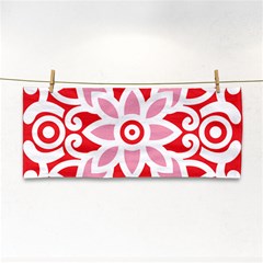 A Red And White Pattern With A Flower On It Hand Towel