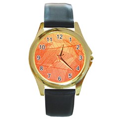 Abstract Texture Of Colorful Bright Pattern Of Transparent Leaves Of Orange And Yellow Color Round Gold Metal Watch