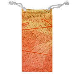 Abstract Texture Of Colorful Bright Pattern Of Transparent Leaves Of Orange And Yellow Color Jewelry Bag